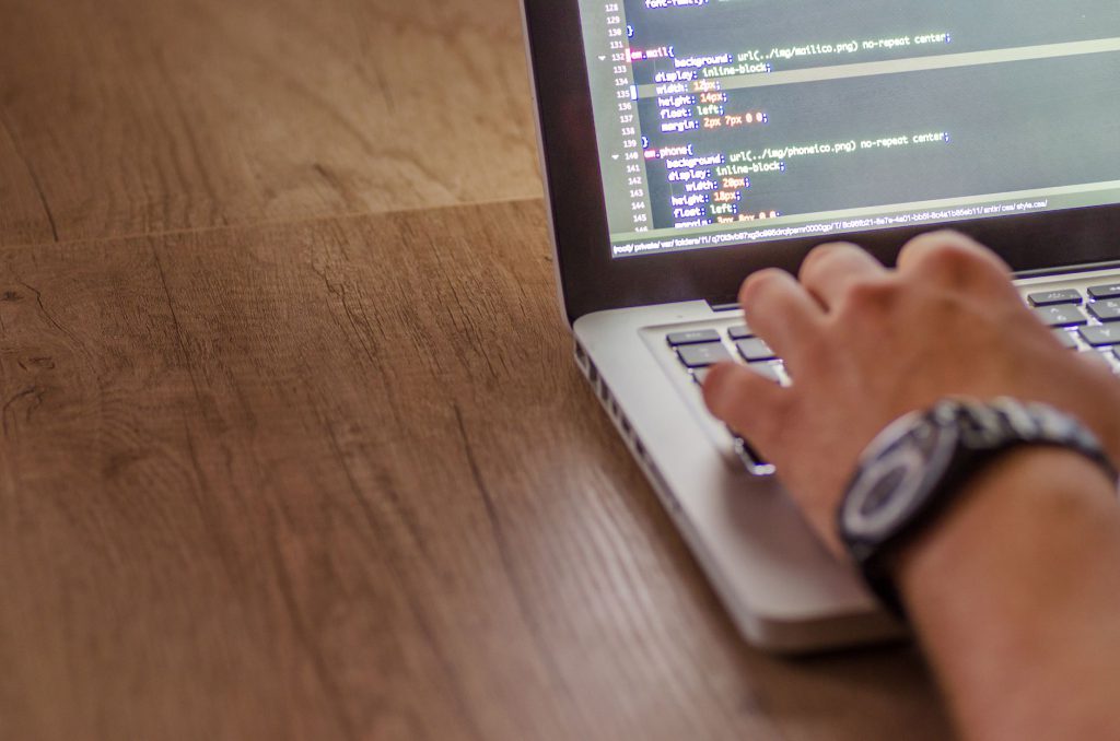 Developer maintaining a WordPress website on a laptop
